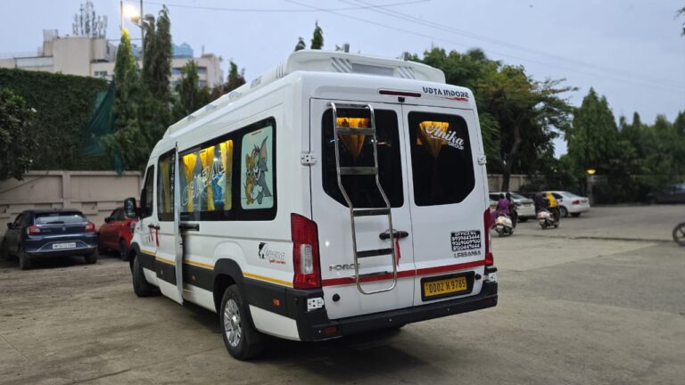 Force Urbania rear view with luggage ladder and roof carrier - Indore
